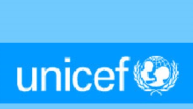 A white UNICEF logo on a blue background