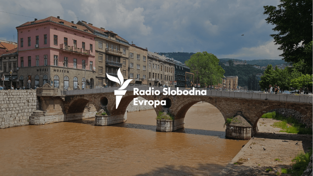 An image of the Balkan RFE/RL logo superimposed on an image of a waterway with a bridge over it