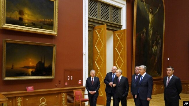 Heads of ex-Soviet nations tour the State Russian Museum with Vladimir Putin in St. Petersburg.