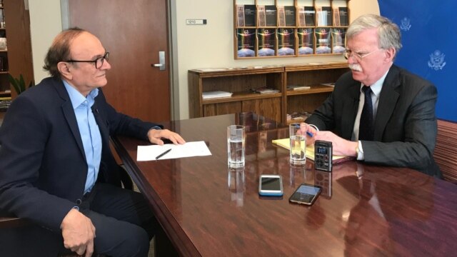 U.S. National Security Advisor John Bolton and RFE/RL Armenian Service Director Harry Tamrazian, in Yerevan, Armenia. 25 Oct 2018